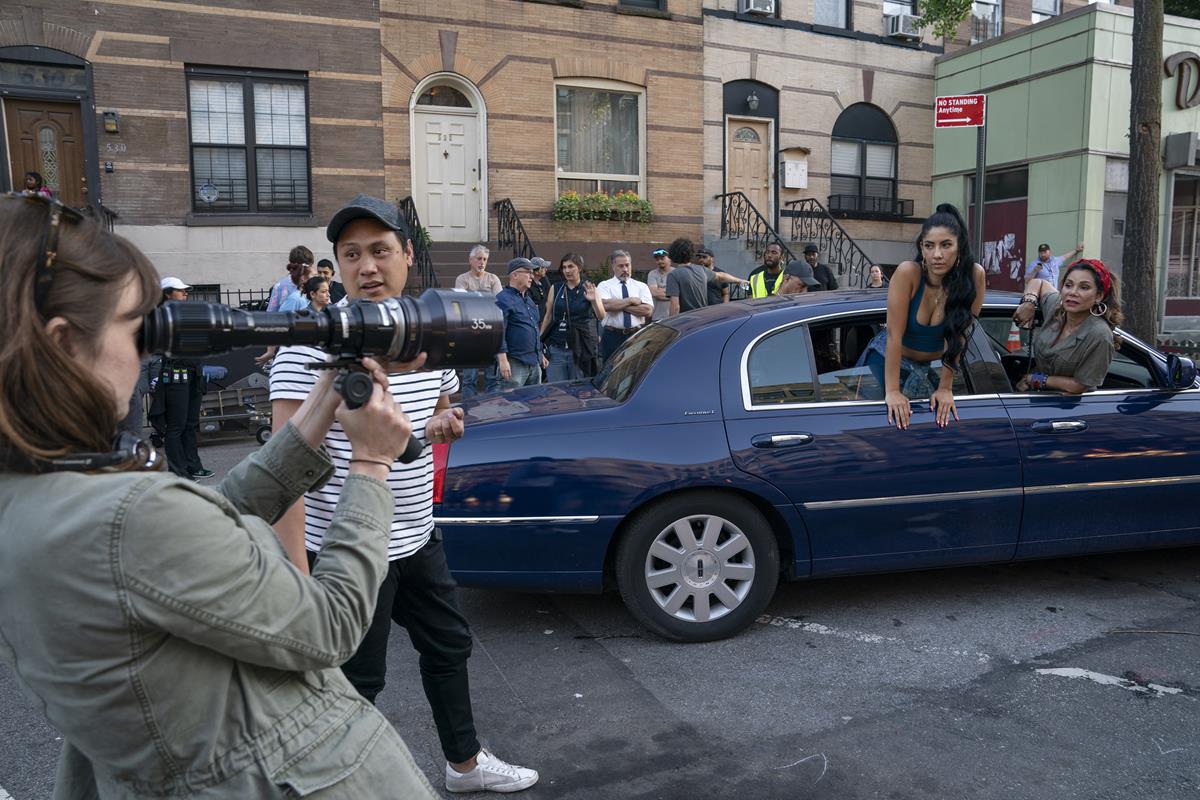 Director of photography Alice Brooks (foreground), director Jon M. Chu, Stephanie Beatriz and Daphne Rubin-Vega on the set of director Jon Chu’s screen adaptation of “In The Heights.” Cr: Macall Polay/Warner Bros.