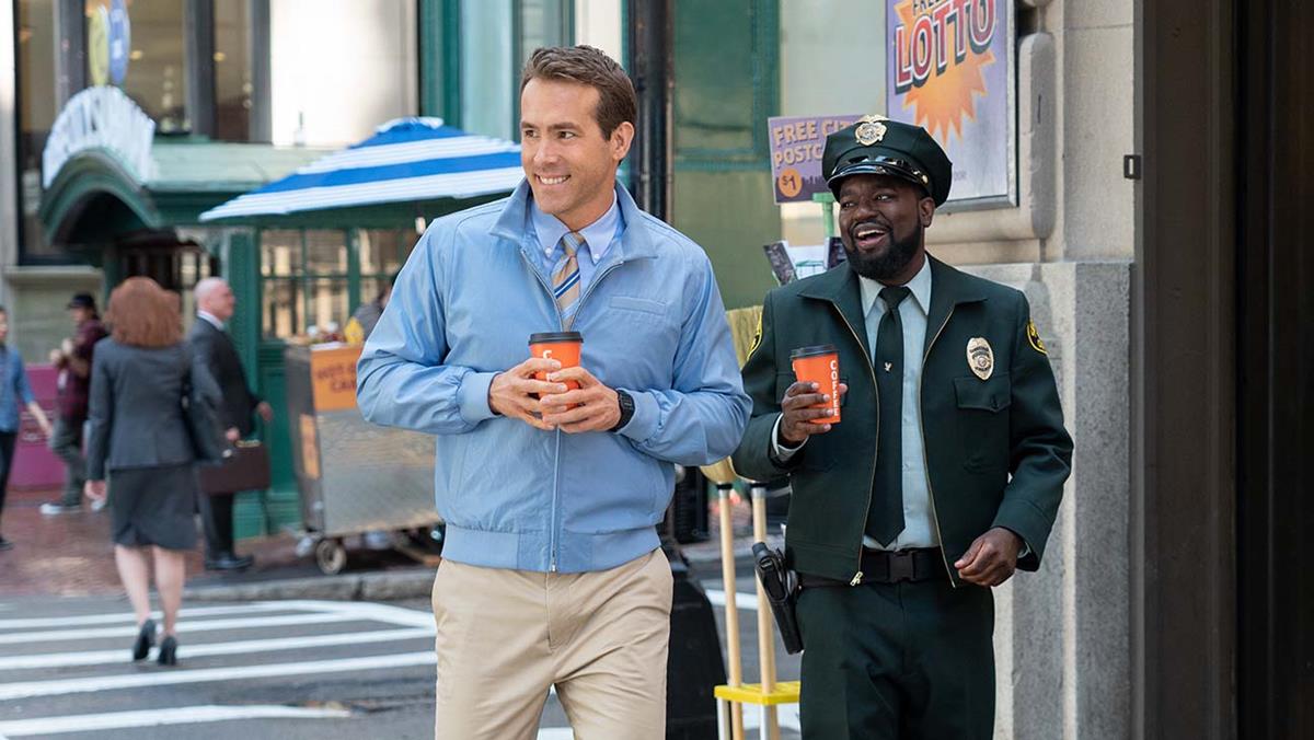 Ryan Reynolds as Guy and Lil Rey Howery as Buddy in “Free Guy.” Cr: 20th Century Studios