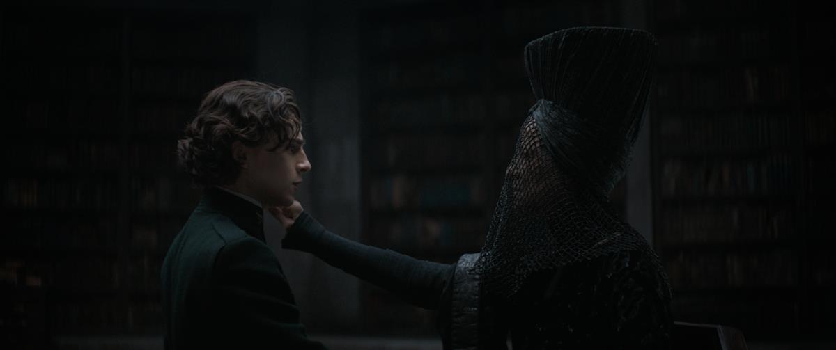 Timothée Chalamet as Paul Atreides and Charlotte Rampling as Reverend Mother Mohim in director Denis Villeneuve’s “Dune.” Cr: Warner Bros