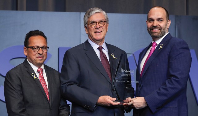 Former President and CEO Gordon Smith (center), receives the NAB Distinguished Service Award from Curtis LeGeyt (right), NAB President and CEO, and David Santrella, CEO, Salem Media Group and NAB Joint Board Chair.