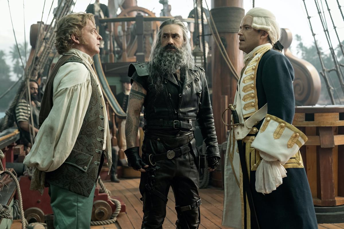 Rhys Darby as Stede Bonnet, Taika Waititi as Blackbeard, and Rory Kinnear as Captain Nigel Badminton in season 1 episode 9 of “Our Flag Means Death.” Cr: Warner Media