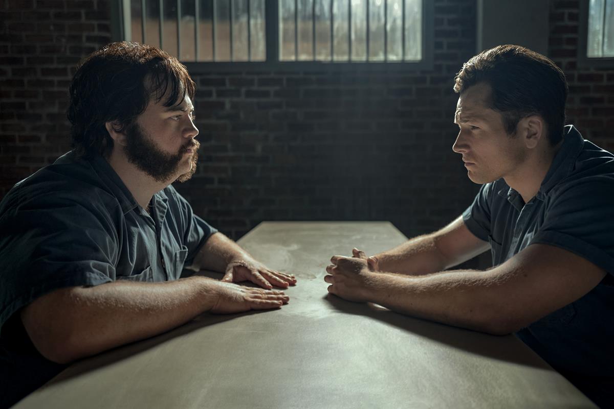 Paul Walter Hauser as Larry Hall and Taron Egerton as Jimmy Keene in episode 3 of “Black Bird.” Cr: Gavin Bond/Apple TV+