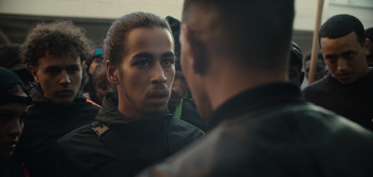 Sami Slimane as Karim in director Romain Gavras’s “Athena.” Cr: Netflix